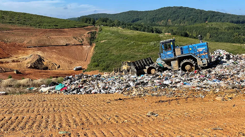 blue aljon compactor at landfill