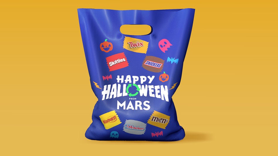 A bag, decorated with candy bar logos, designed for recycling candy wrappers