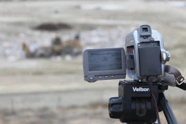 Photo of a video camera recording operations at a landfill