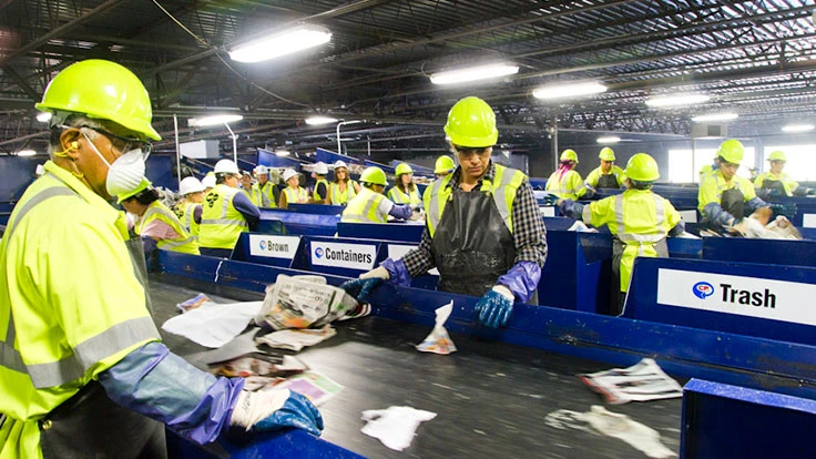 people in yellow hardhats and jackets