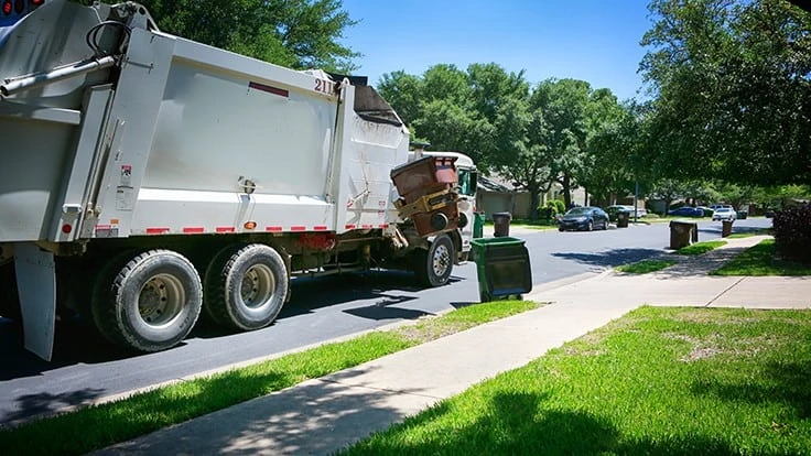 garbage truck emptying container