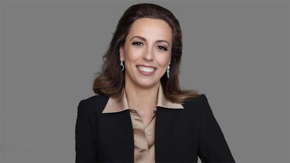 a smiling woman with brown hair