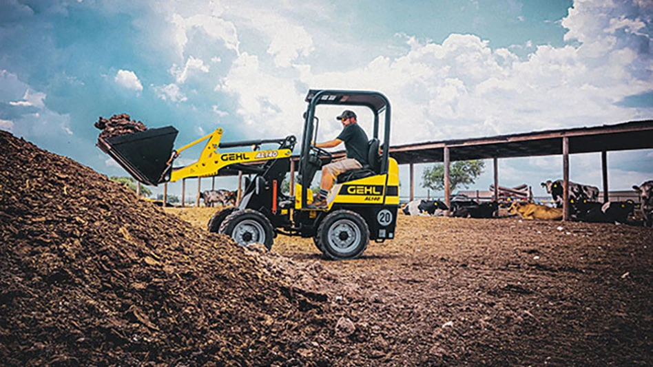 gehl skid loader moving carrying material