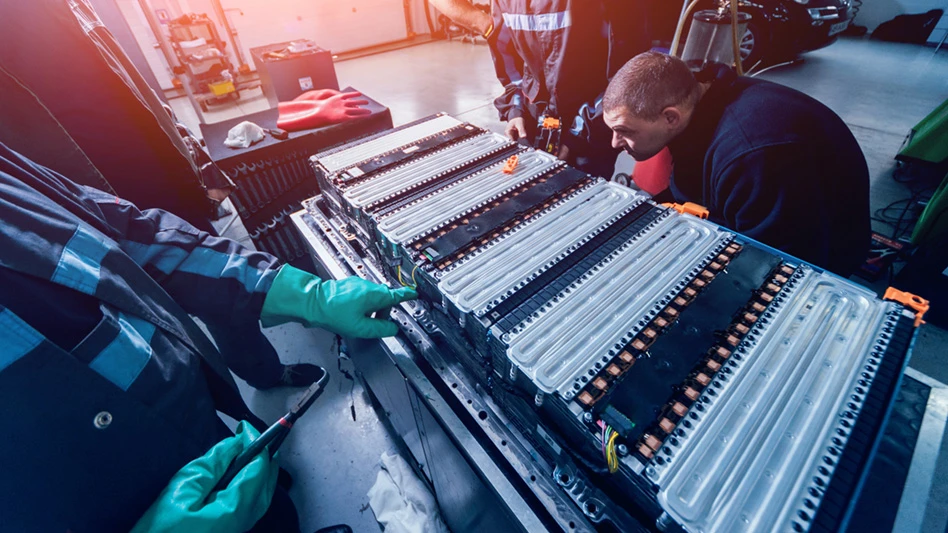 technicians working with an electric vehicle battery