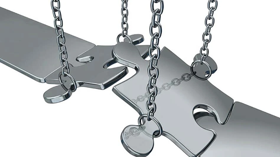 Metal puzzle pieces forming a bridge