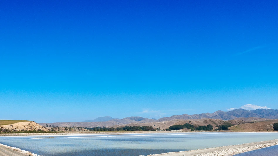 An evaporation pond in Arizona, under a clear blue sky.