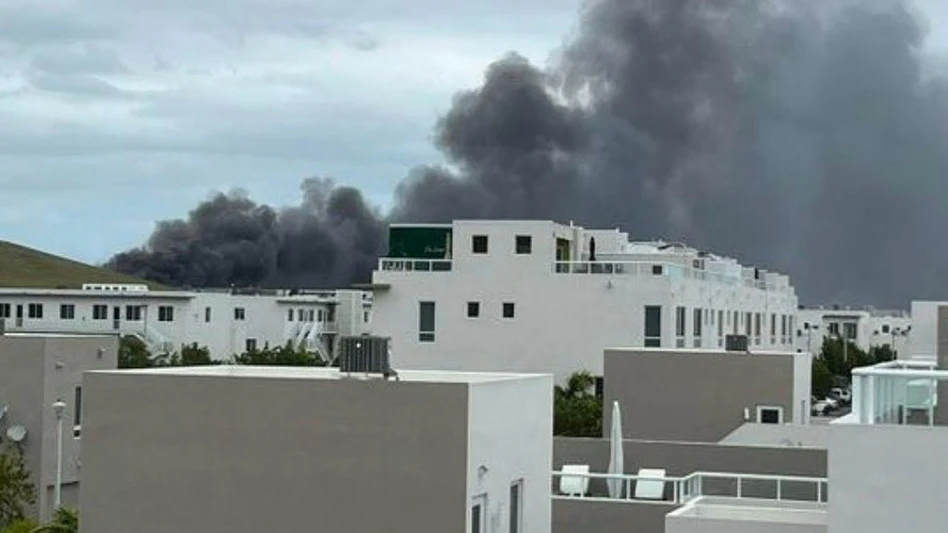 Smoke billows from a fire at the Covanta waste-to-energy facility near Miami.