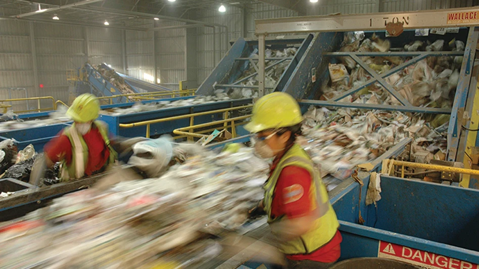workers on a sorting line at a MRF