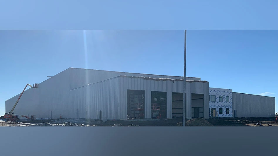 the exterior of a building with four truck bays