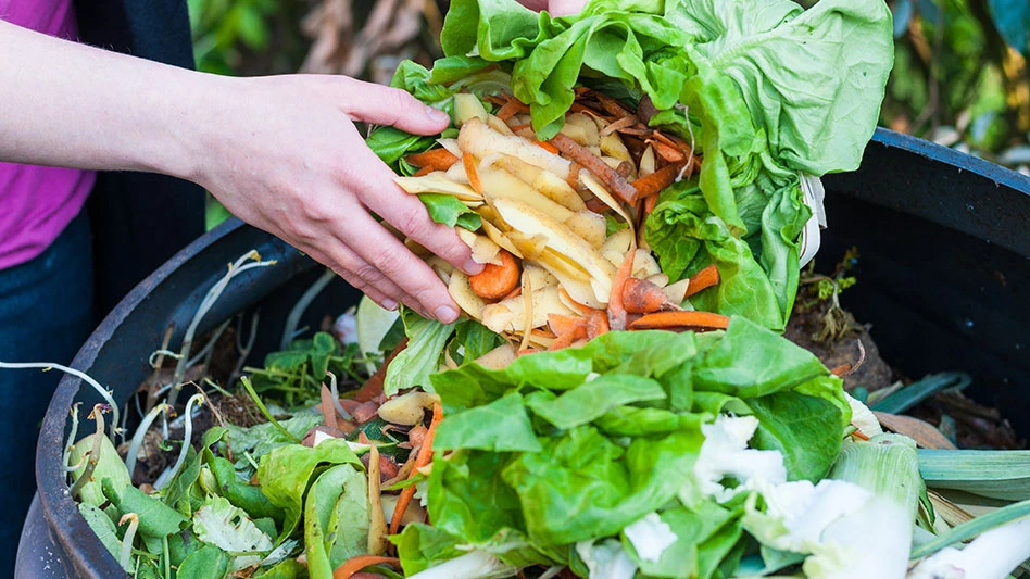 food waste being dumped into bin