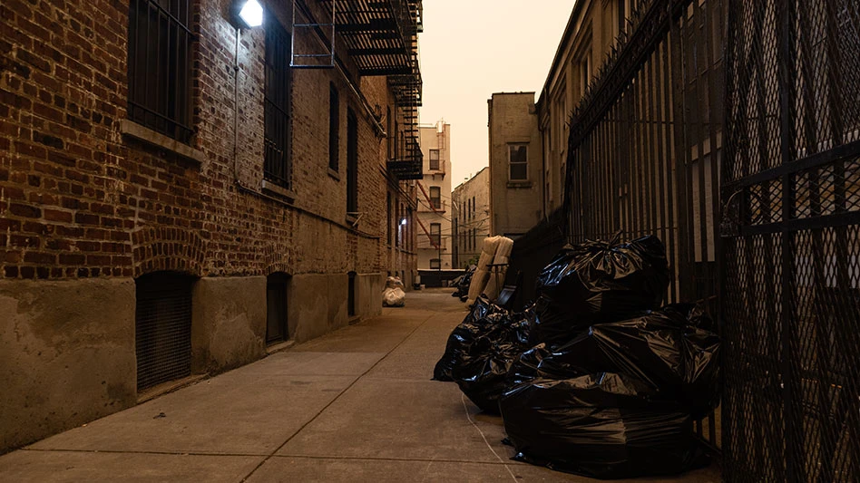 Old residential building alleyway in Astoria, Queens, with orange haze from air pollution caused by Canadian wildfires