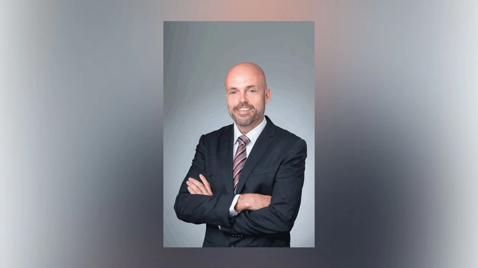 darrell smith a balding man with facial hair and his arms crossed