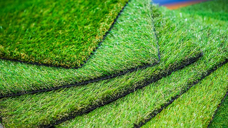 six sheets of artificial turf grass stacked on top of each other