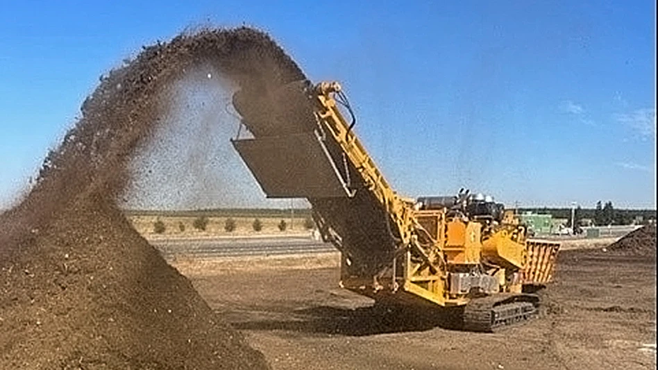 yellow machinery processing compost