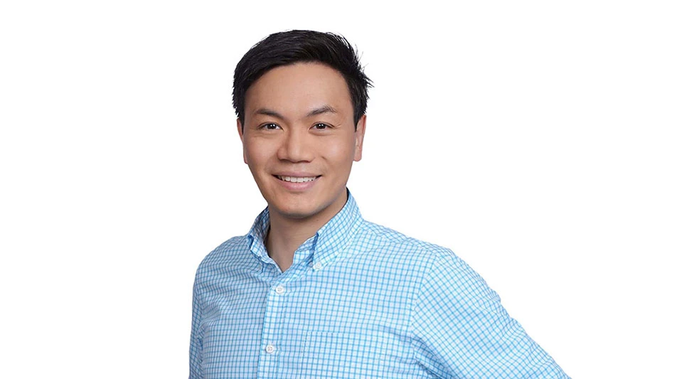 a man in a blue shirt against a white background