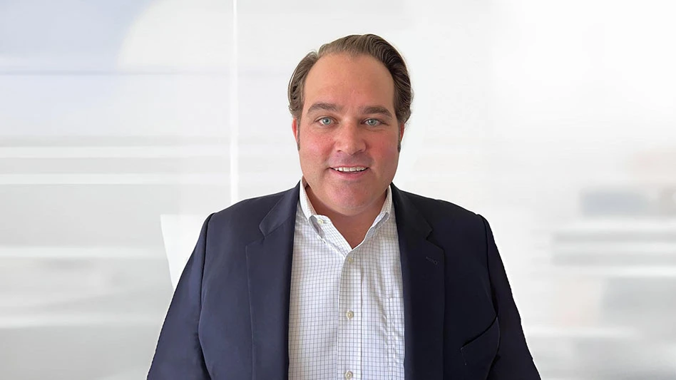 man in blue suit jacket with white button down shirt