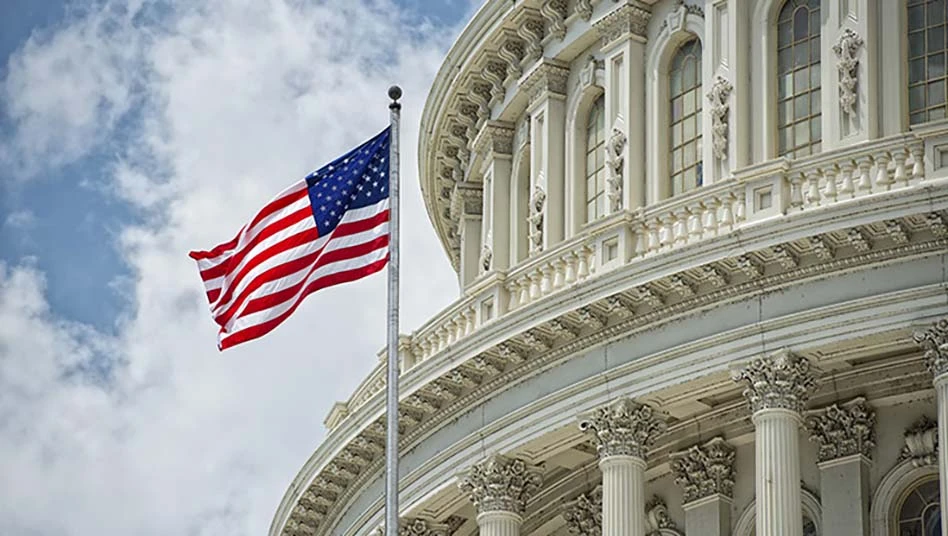 us capitol building with american flag