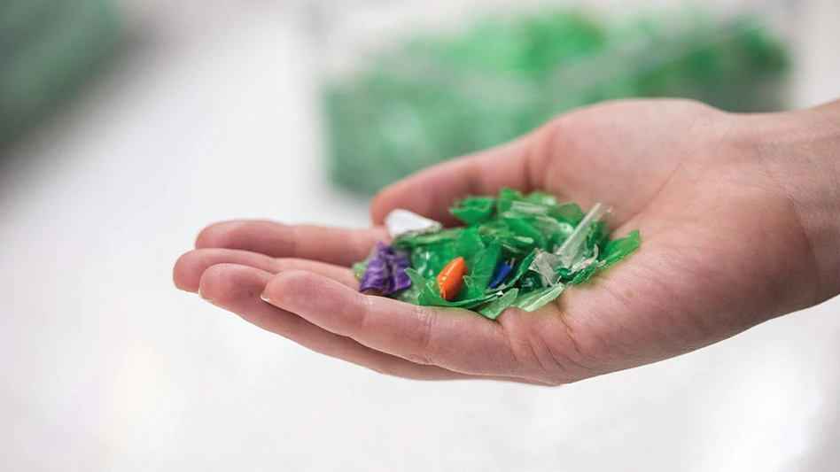 A hand holding recycled PET.