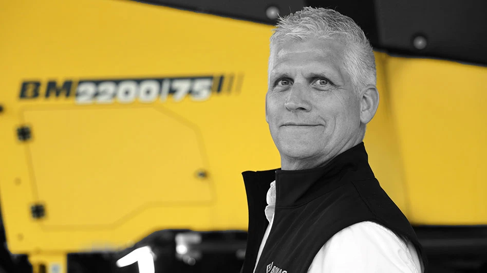 black-and-white photo of a white man on a yellow background