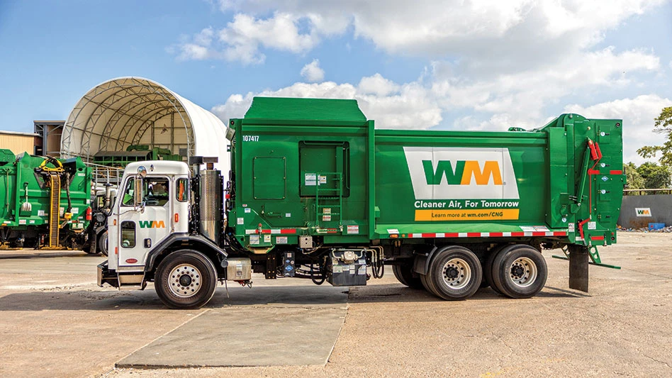WM truck parked in front of a building