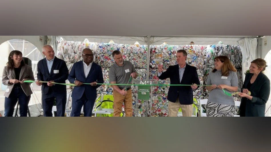 a group of people cut the ribbon at the WM Pittsburgh Recycling Facility grand opening