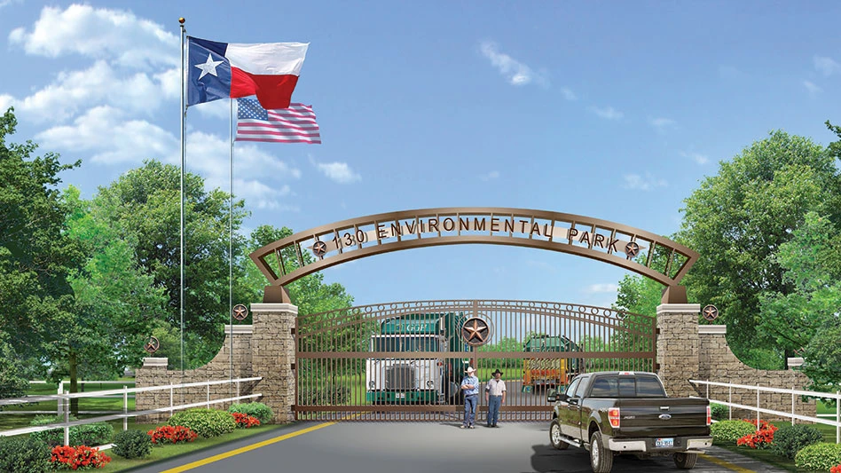 Texas and U.S. flags fly over landfill gate on a sunny day