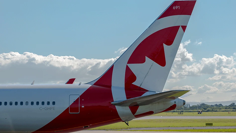 rear end of plane with air canada red maple leaf logo