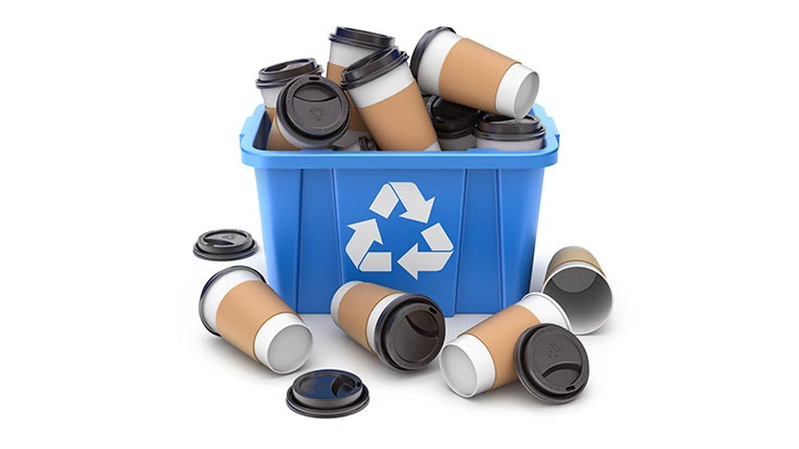 paper cups in a blue recycling container