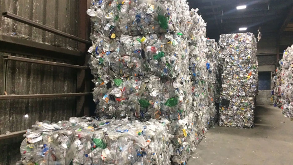 bales of plastic stacked up in a mrf