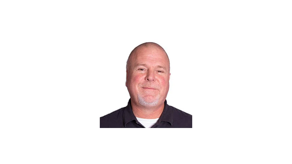 photo of a white bald man smiling