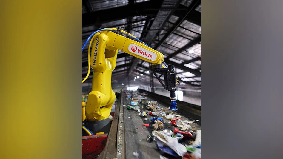 sorting robot above a conveyor belt with recyclables