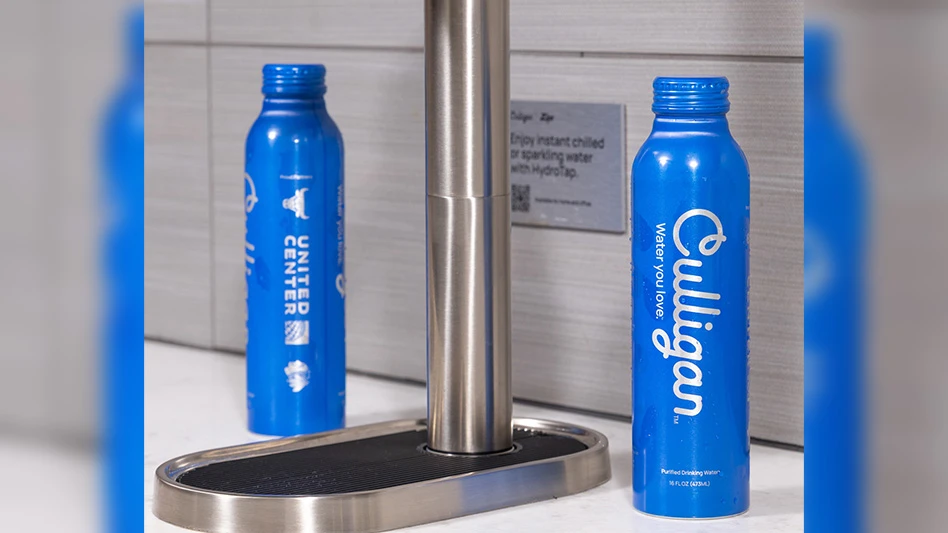 two blue aluminum water bottles at a stainless steel water fountain station