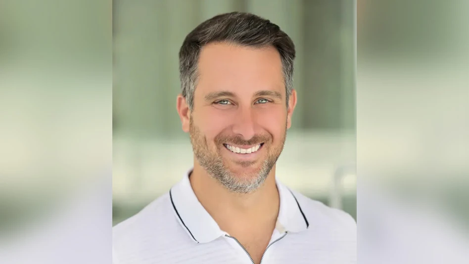 man wearing white polo shirt smiling