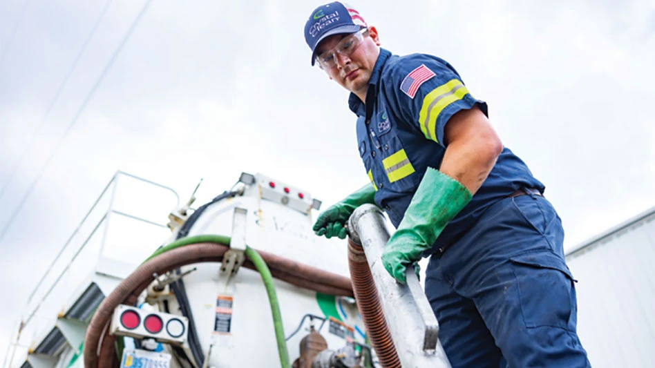man operating waste management equipment