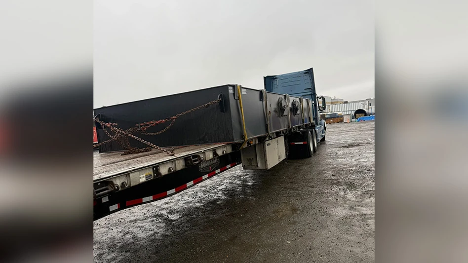 rear view of truck hauling shipment of equipment
