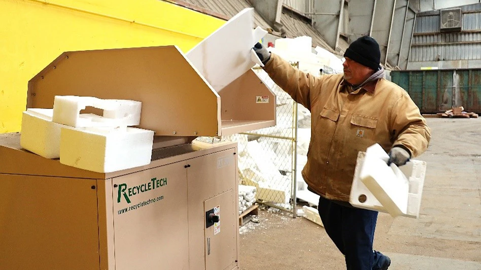 man putting foam into recycling bin