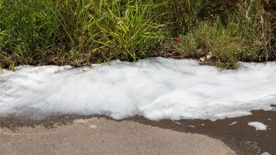 white pfas foam on grass/ground